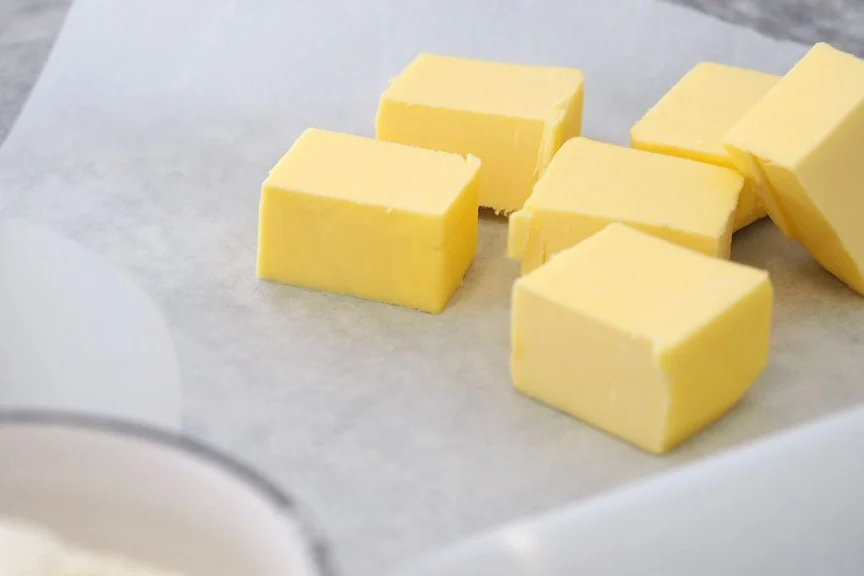 Plain butter cubes on parchment paper