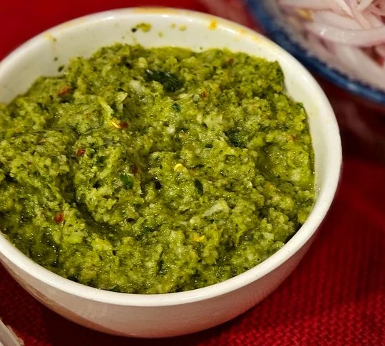 Green herb chutney with a coarse, fresh texture