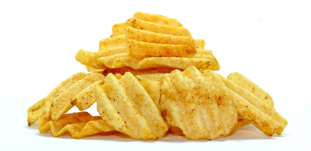 Ridged potato chips with a dry seasoning coating
